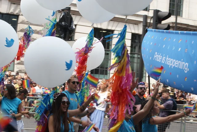 View of Twitter balloons and streamers in the Pride London parade